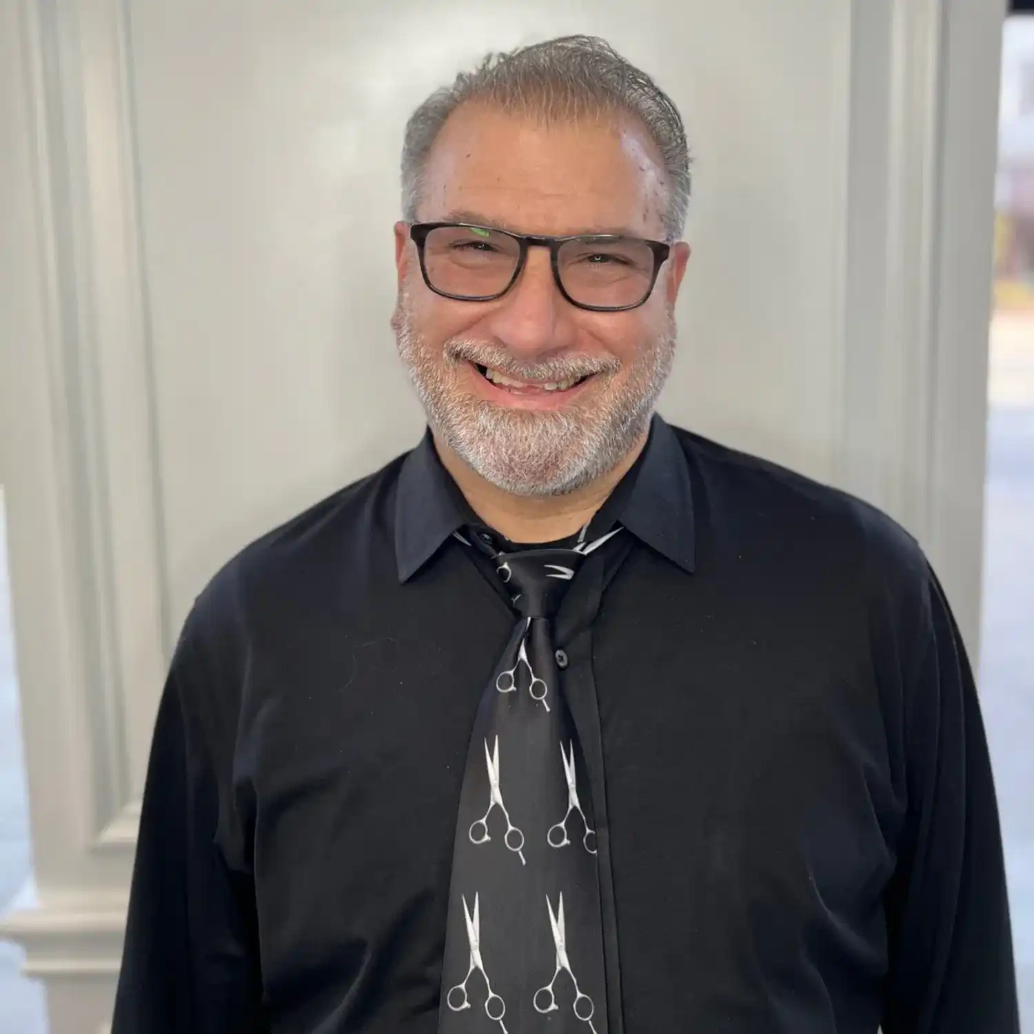 Portrait of Peter, a professional stylist at Panico Salon & Spa, showcasing their expertise and style.