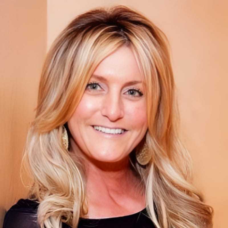 Portrait of Michele, a professional stylist at Panico Salon & Spa, showcasing their expertise and style.