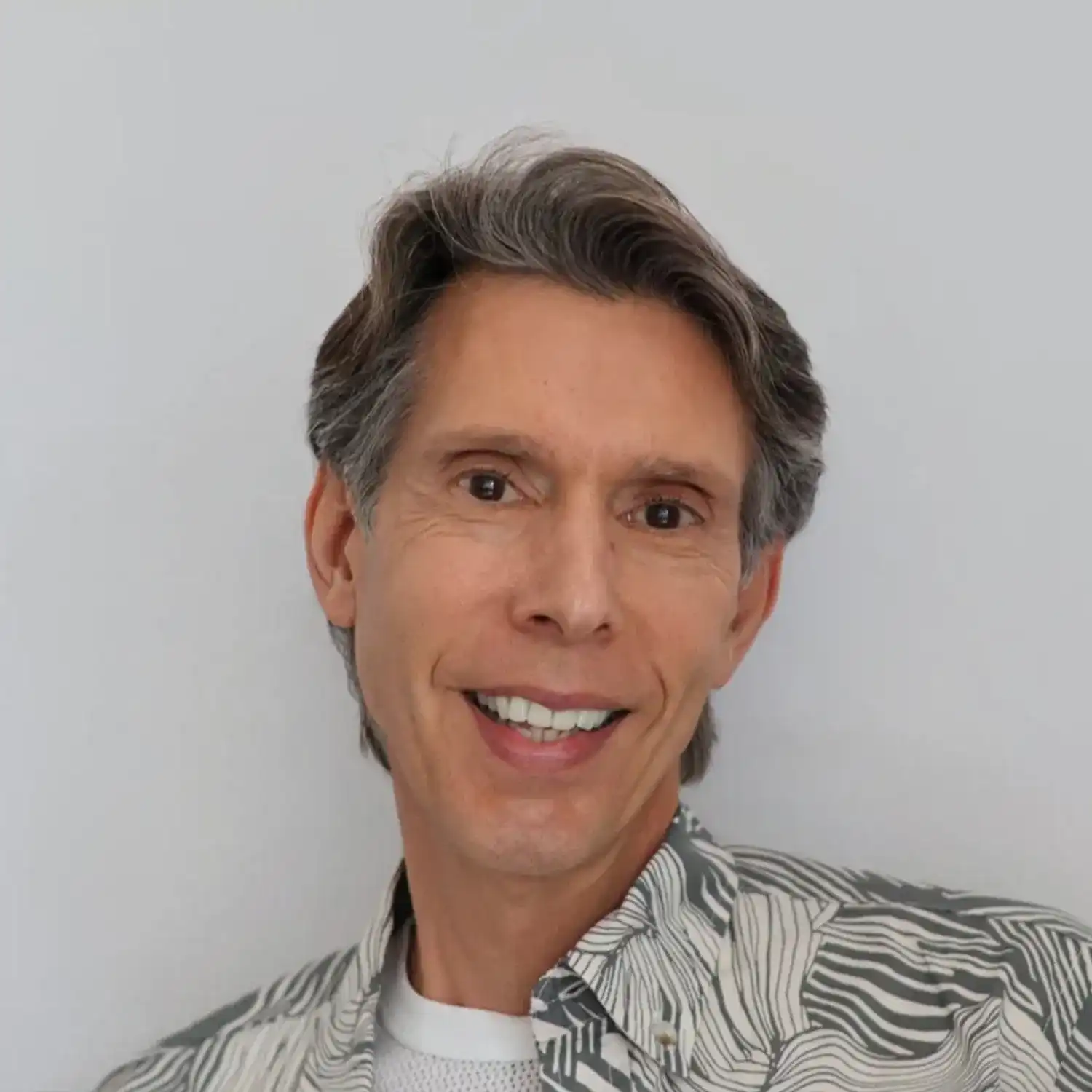 Portrait of Angelo, a professional stylist at Panico Salon & Spa, showcasing their expertise and style.