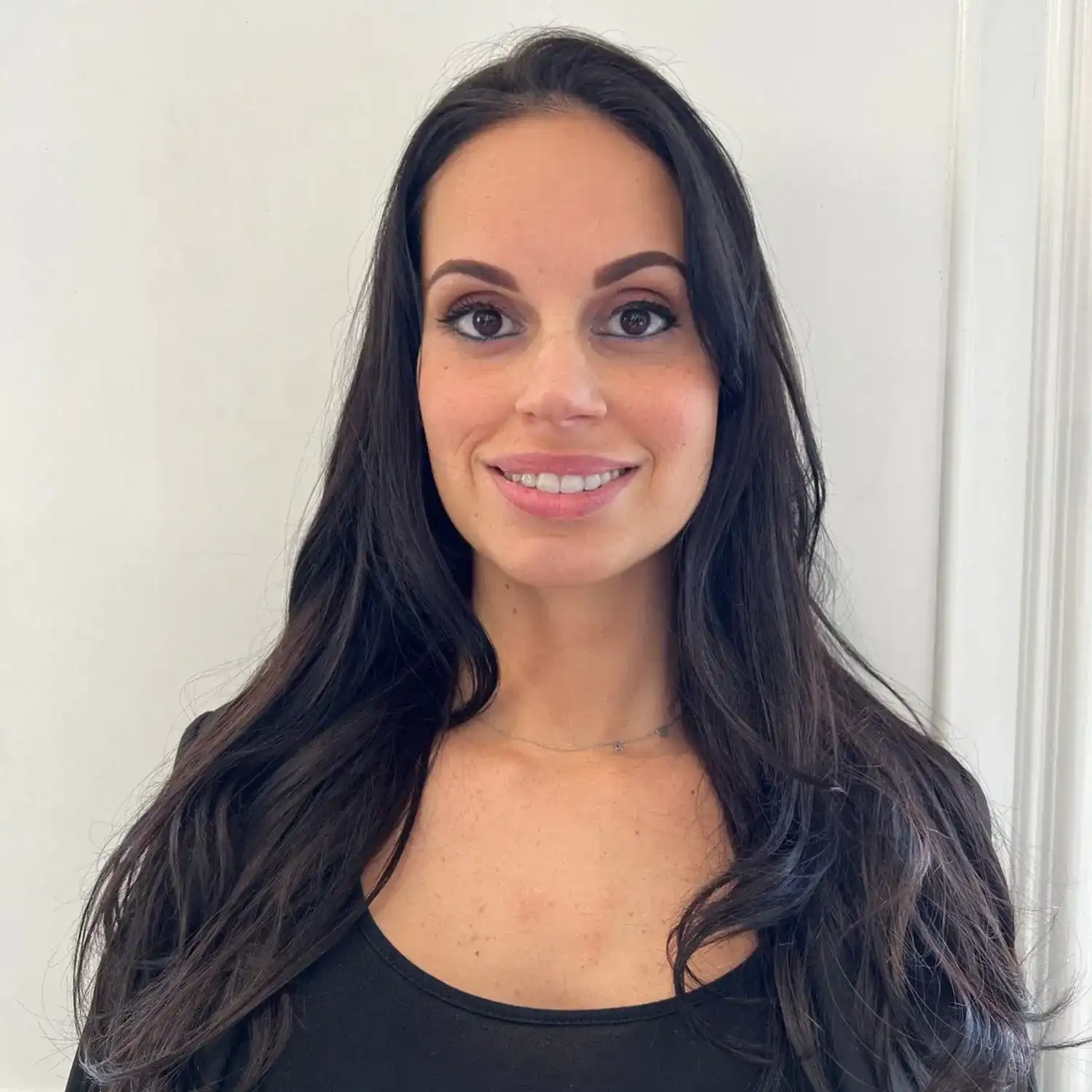 Portrait of Nicole, a professional stylist at Panico Salon & Spa, showcasing their expertise and style.