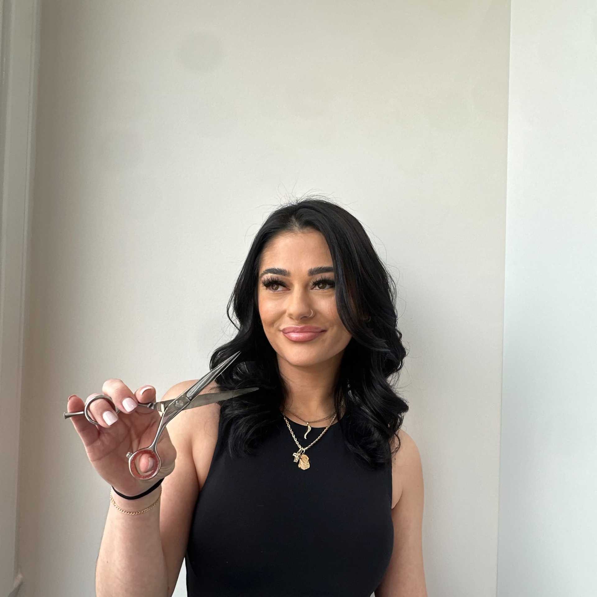 Portrait of Francesca, a professional stylist at Panico Salon & Spa, showcasing their expertise and style.