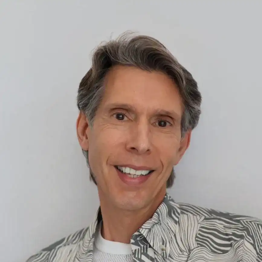 Portrait of Angelo, a professional stylist at Panico Salon & Spa, showcasing their expertise and style.