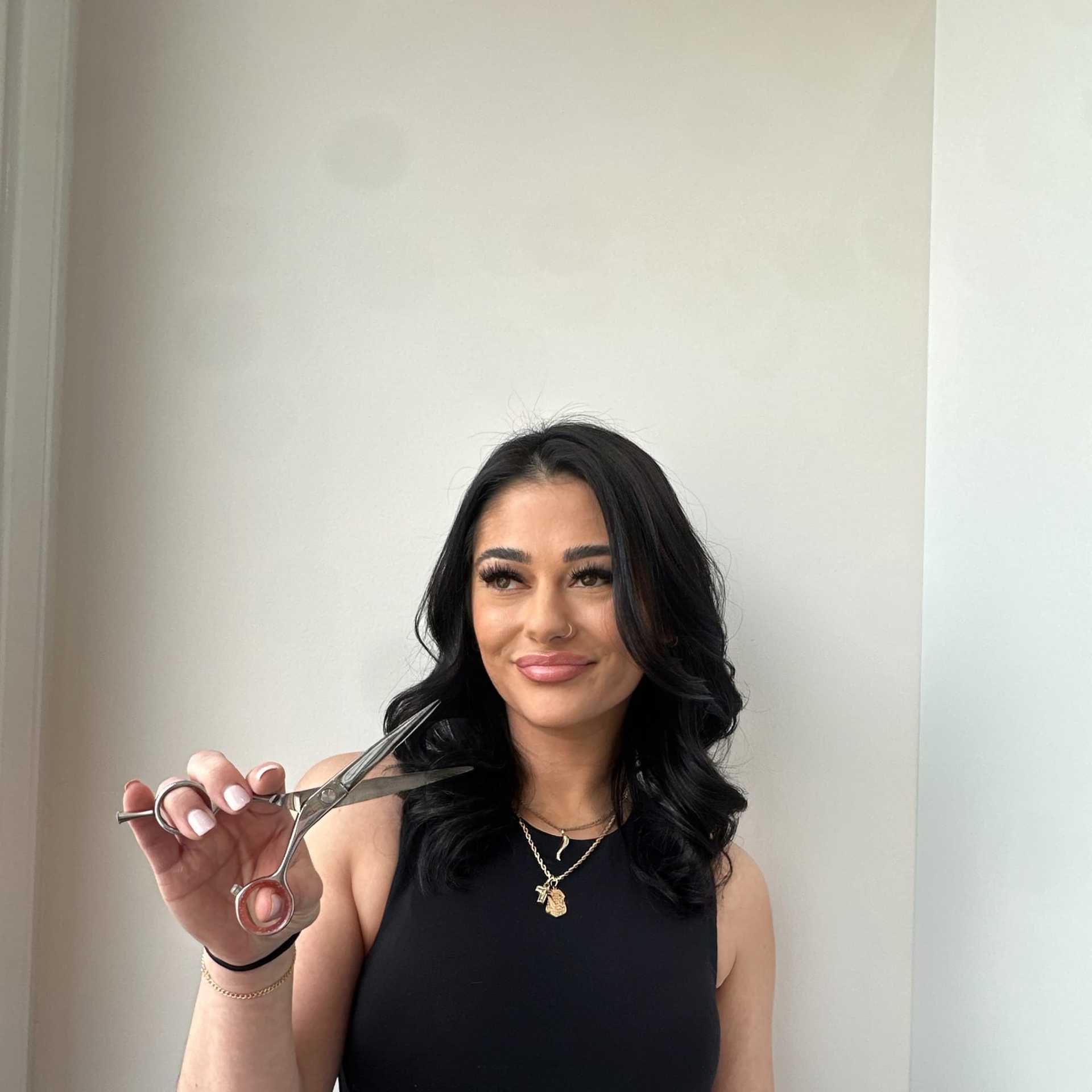 Portrait of Francesca, a professional stylist at Panico Salon & Spa, showcasing their expertise and style.